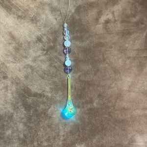 Elegant beaded with lots of sparkle car charm suncatcher .